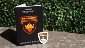 Image of the Fire and Reign passport and the first sticker.